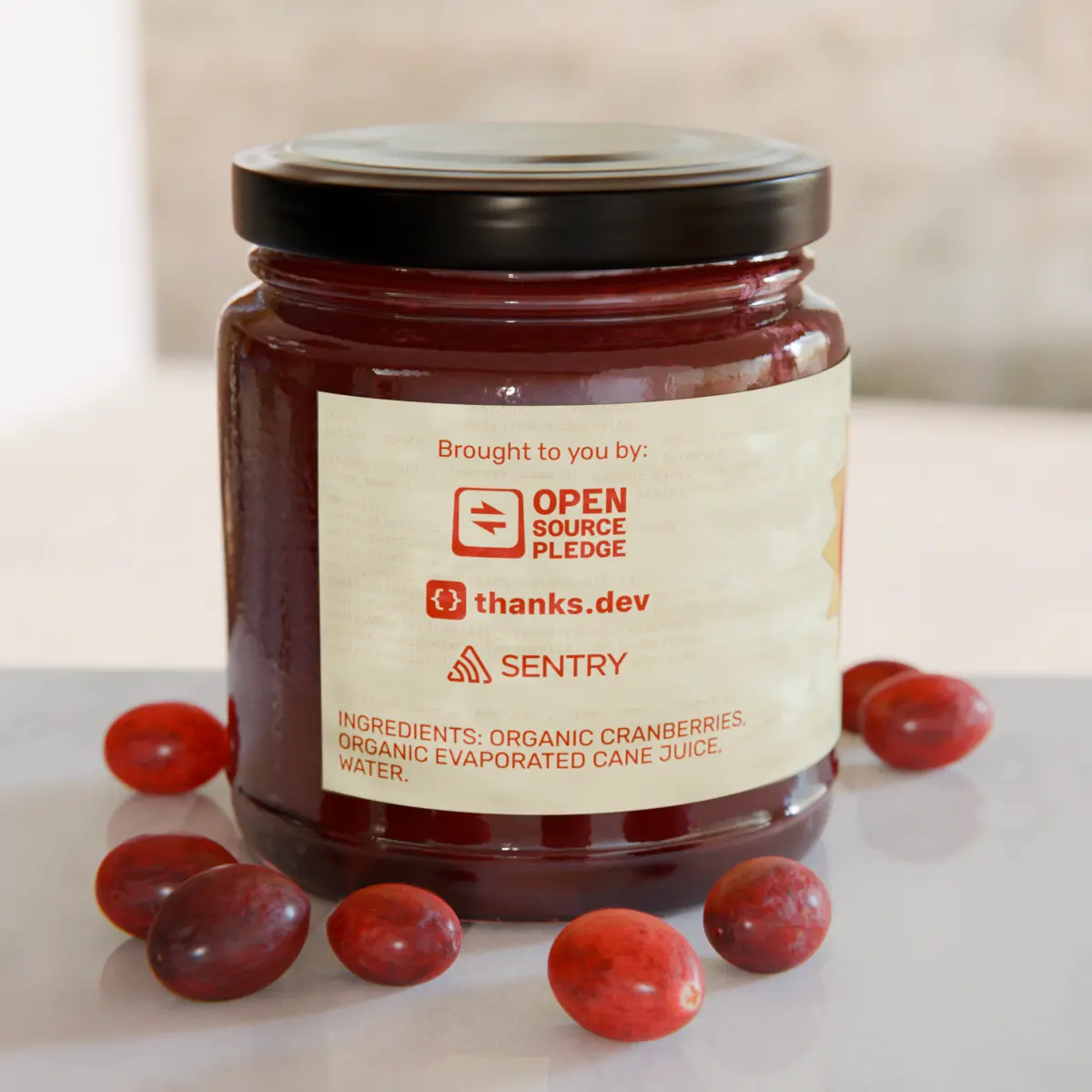 A jar of cranberry sauce, with the back part of the label visible, reading “Brought to you by: Open Source Pledge, thanks.dev, Sentry.